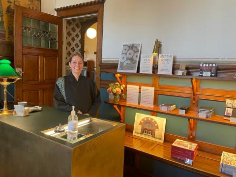 A lovely and happy registrar who is waiting to check documents!