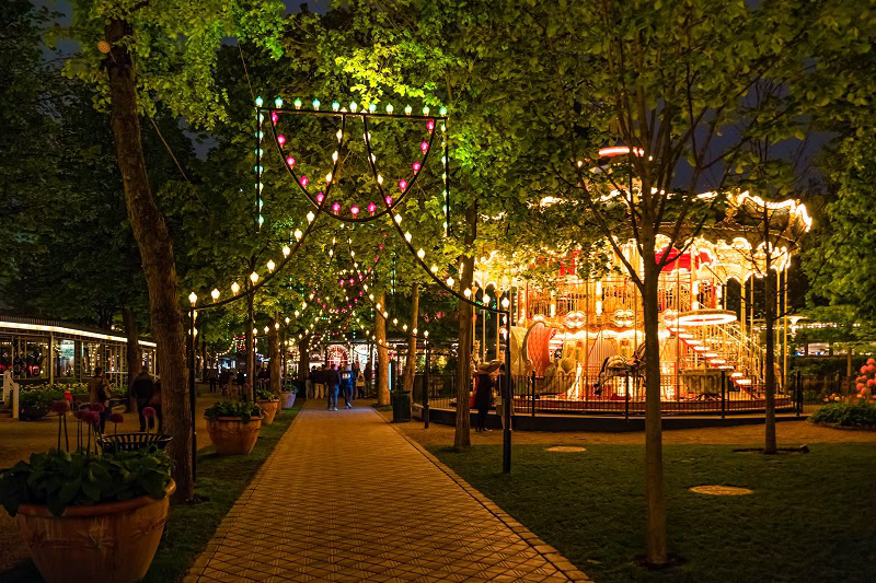 vintage carousel in tivoli gardens, amusement park in copenhagen