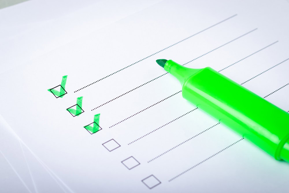 check list and green marker